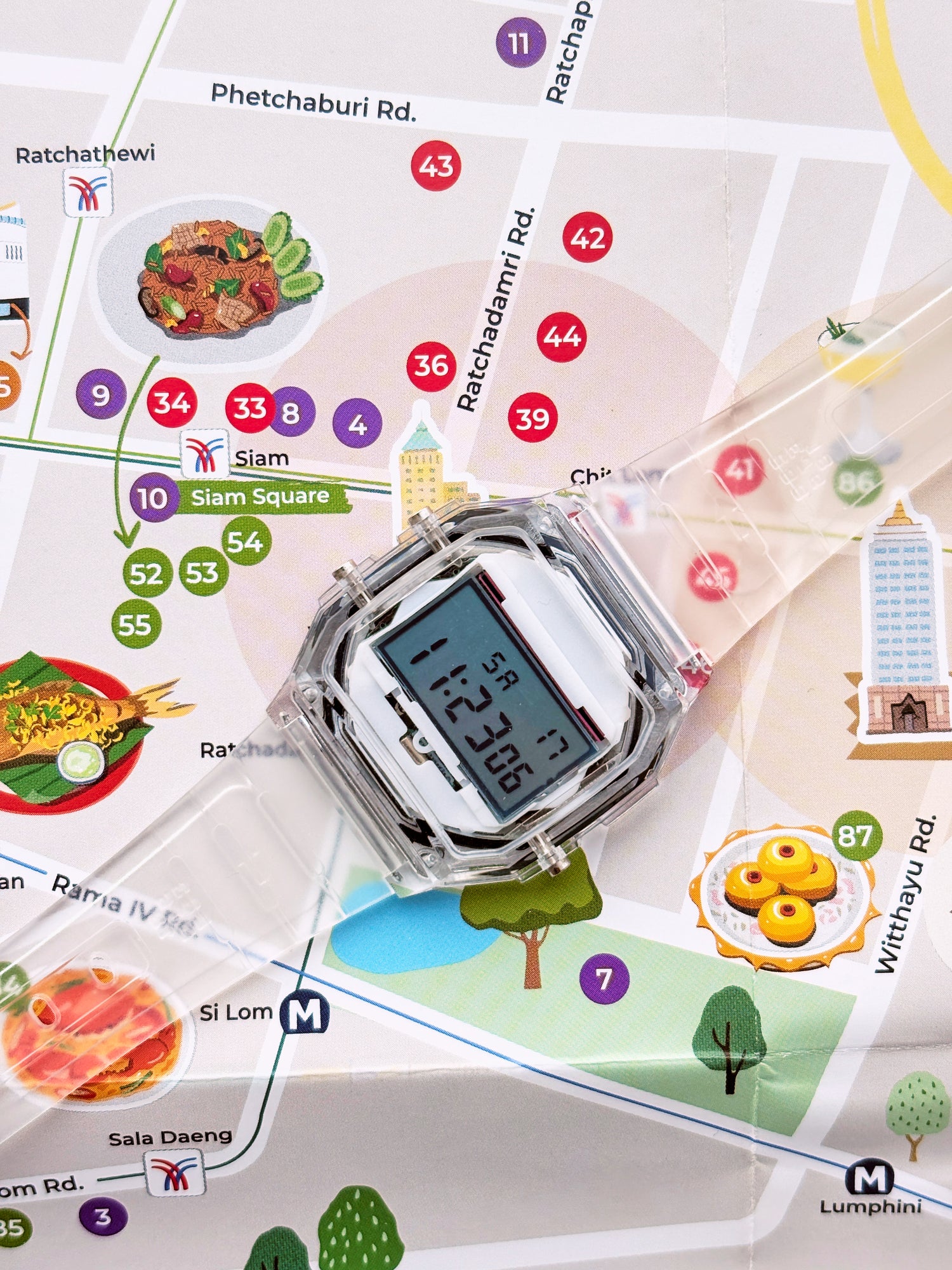 Digital watch displayed on a map with various icons and text